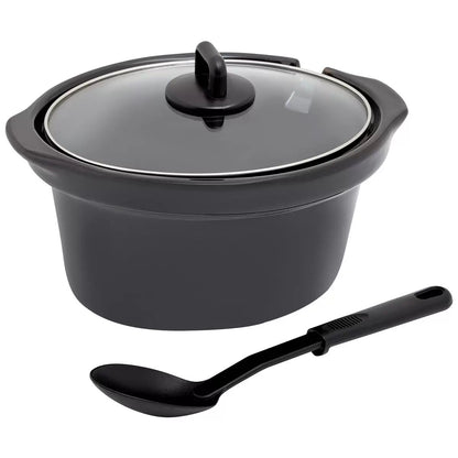 Black ceramic cooking pot with glass lid and black ladle on a white background