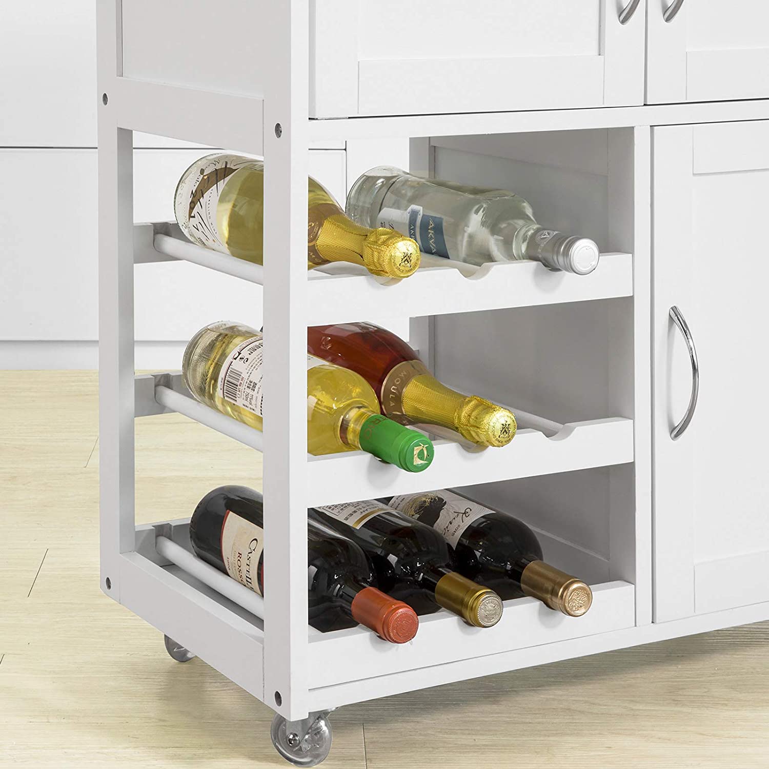 White kitchen cart with wine bottles on a light wood floor.
