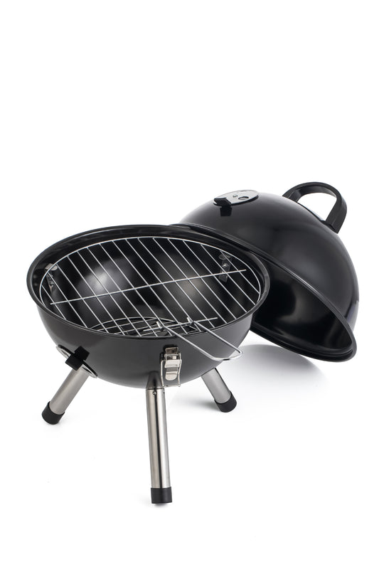 Portable barbecue grill with lid open on a white background