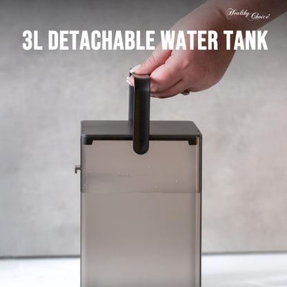 3L detachable water tank with a hand holding onto it against a neutral background
