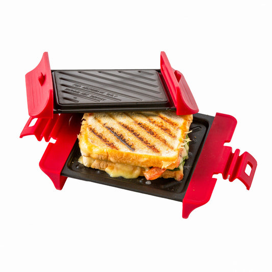 Small grill with a grilled sandwich inside on a white background
