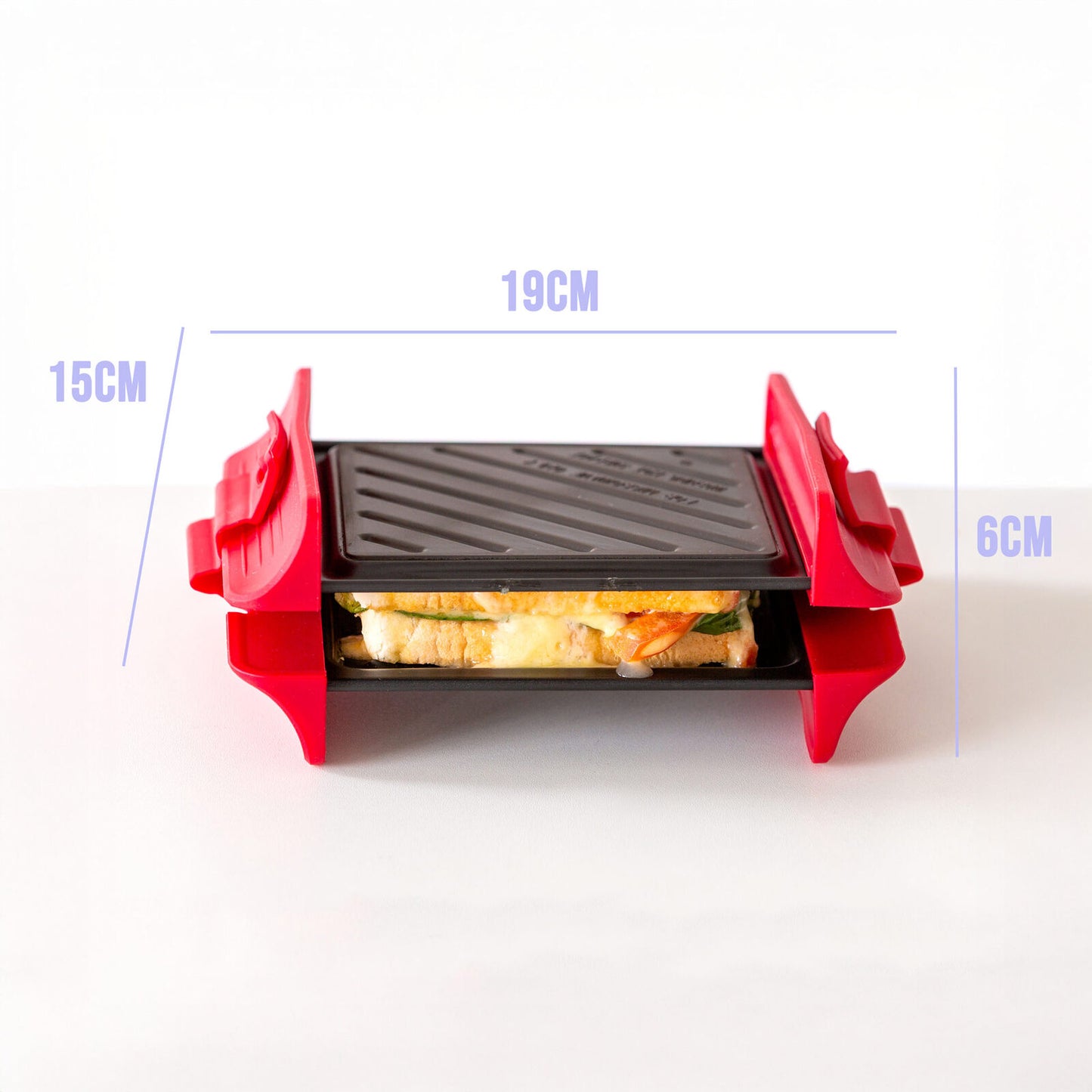 Red sandwich maker with dimensions labeled on a white background