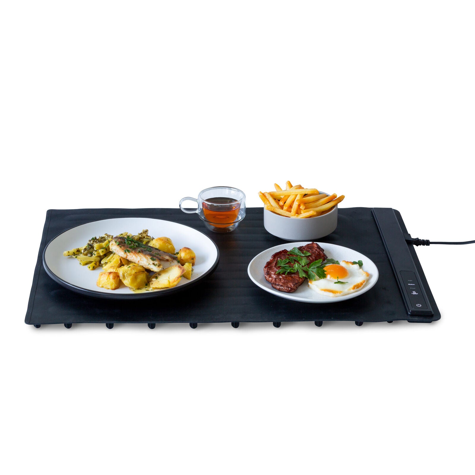 Portable electric cooktop with plates of food including fish, eggs, and fries on a white background