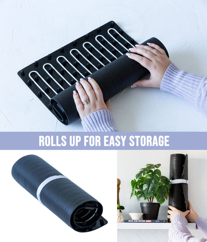 Person unrolling and rolling up a black mat with text 'Rolls up for easy storage' on a white background.