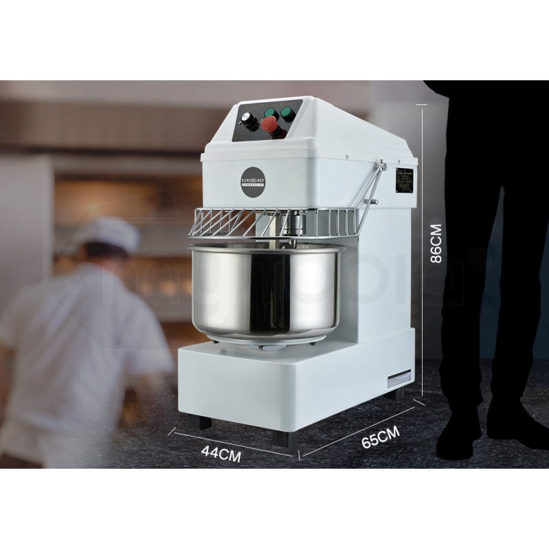 White dough mixer with dimensions displayed, blurred kitchen background