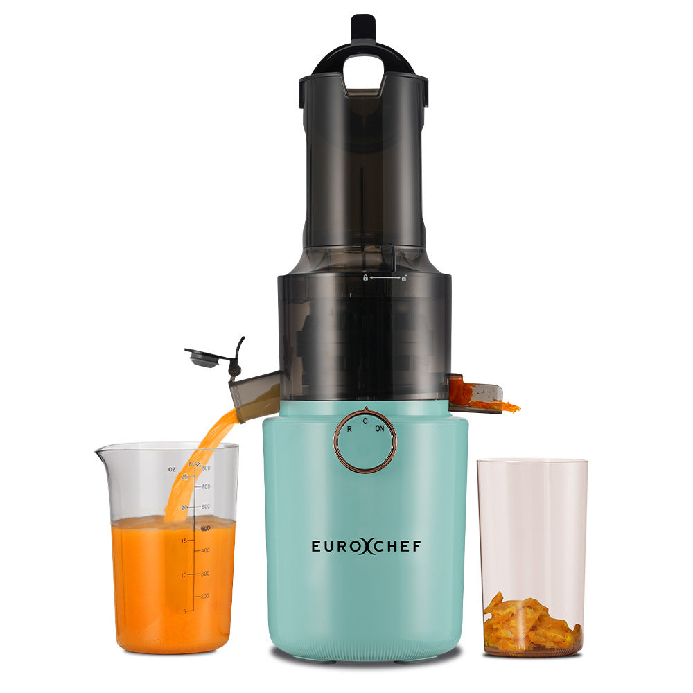 Turquoise juicer with carrot juice being poured into a glass on a white background