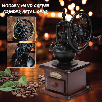 Vintage-style wooden hand coffee grinder with metal gear on a dark background with blurred lights.