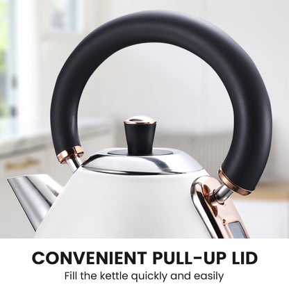 White kettle with black handle and rose gold accents on a blurred kitchen background