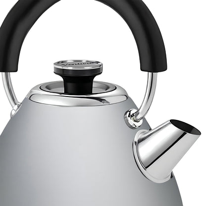 Silver kettle with black handle and lid knob on a white background