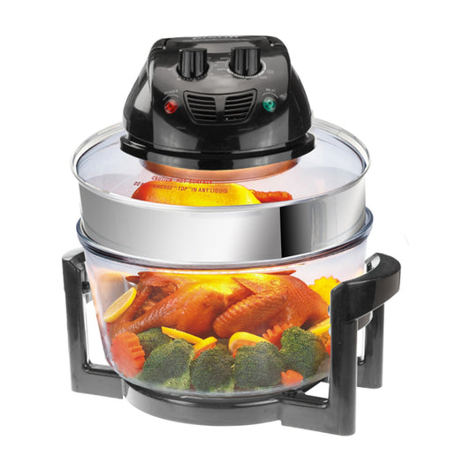 Air fryer with roasted chicken and vegetables inside on a white background