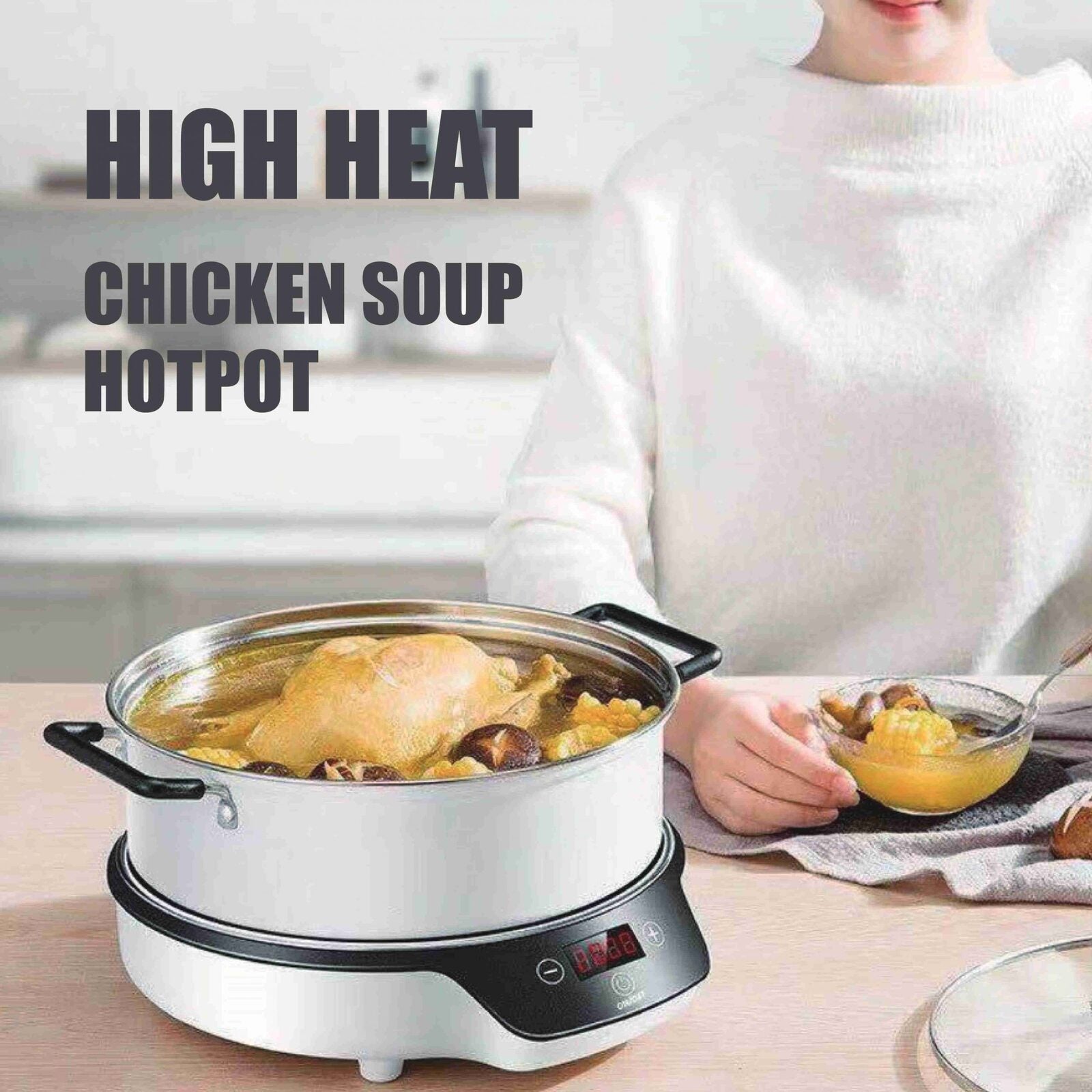 Person holding a bowl of soup next to a chicken soup hotpot on a table.