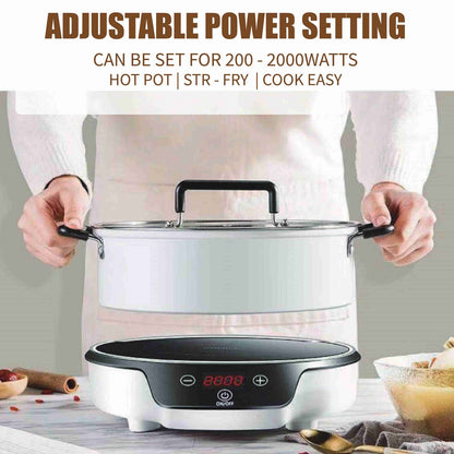 Electric hot pot with adjustable power setting on a kitchen counter