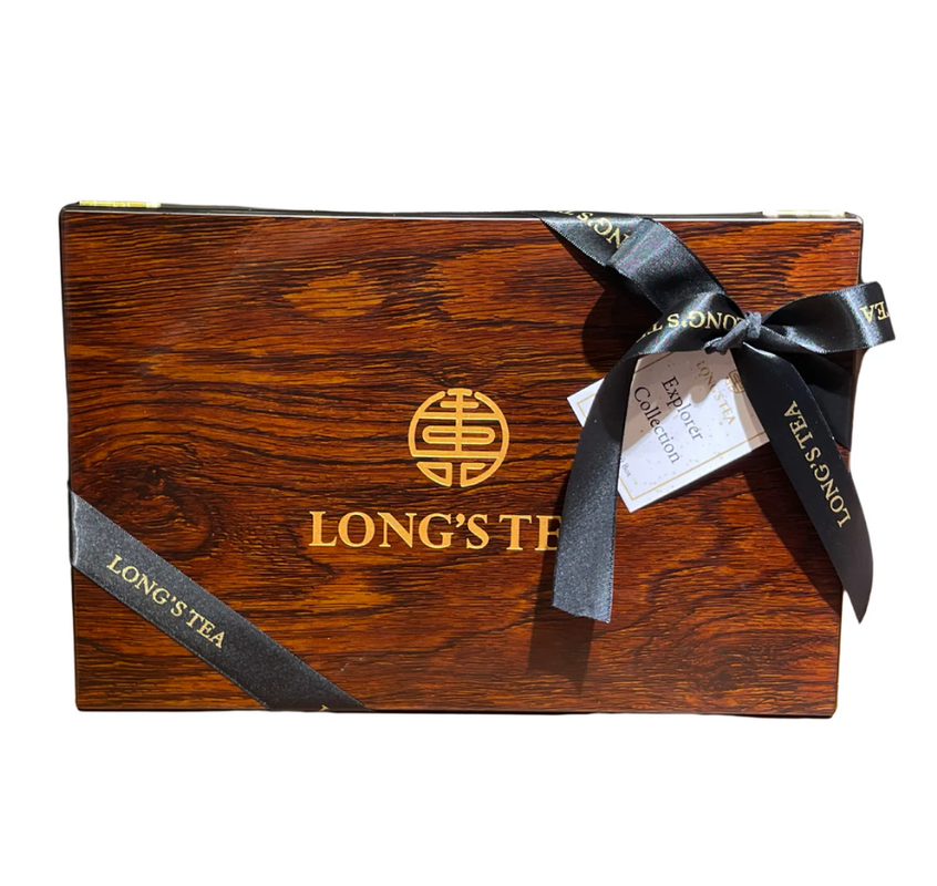 Wooden box with 'LONG'S TEA' branding and a black ribbon on a white background