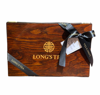 Wooden box with 'LONG'S TEA' branding and a black ribbon on a white background