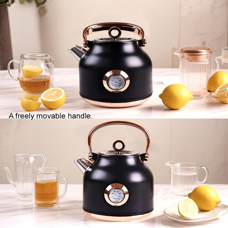 Black kettle with rose gold accents on a table with lemons and glasses.