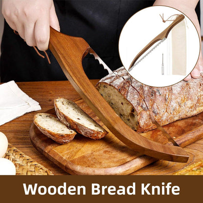 Wooden bread knife being used to cut a loaf of bread on a wooden cutting board.