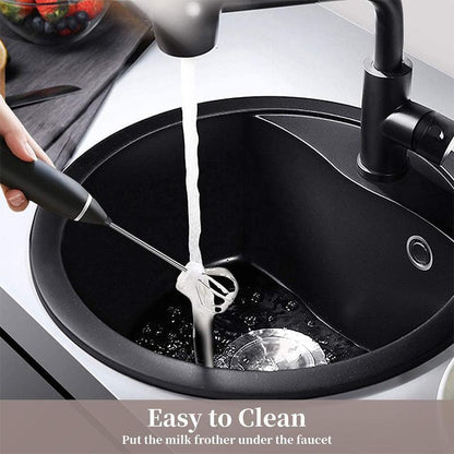 Person using a milk frother in a black sink with text 'Easy to Clean'.