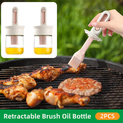 Retractable brush oil bottle being used on a grill with food, set against a green outdoor background.