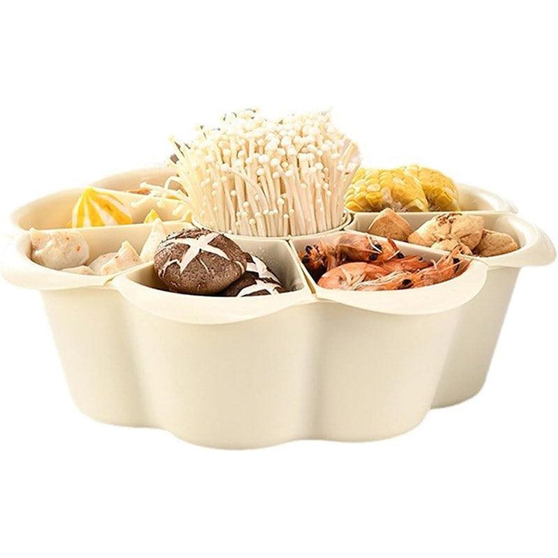 Beige food container with compartments filled with various types of food on a white background