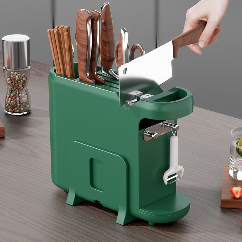 Green knife block with various knives on a wooden surface