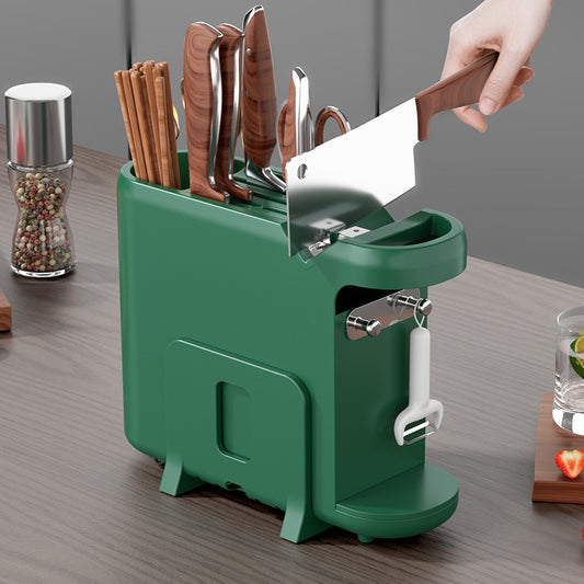 Green knife block with various knives on a wooden surface
