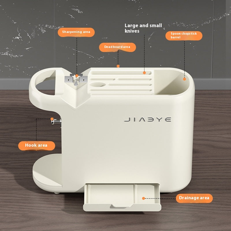 White knife holder with labeled features on a wooden surface