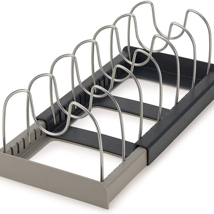 Metal dish rack with black tray on a white background