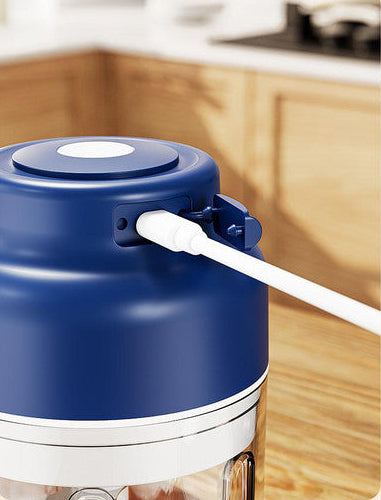 Blue and white electronic device being charged on a kitchen counter with text about charge time and battery life.