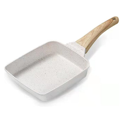 Small square pan with a wooden handle on a white background