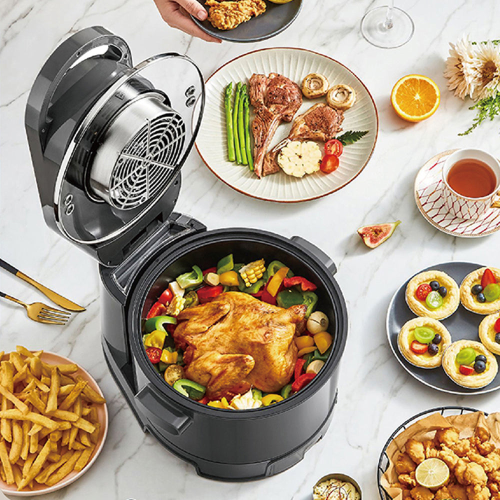 Multifunctional air fryer with cooked food on a marble countertop