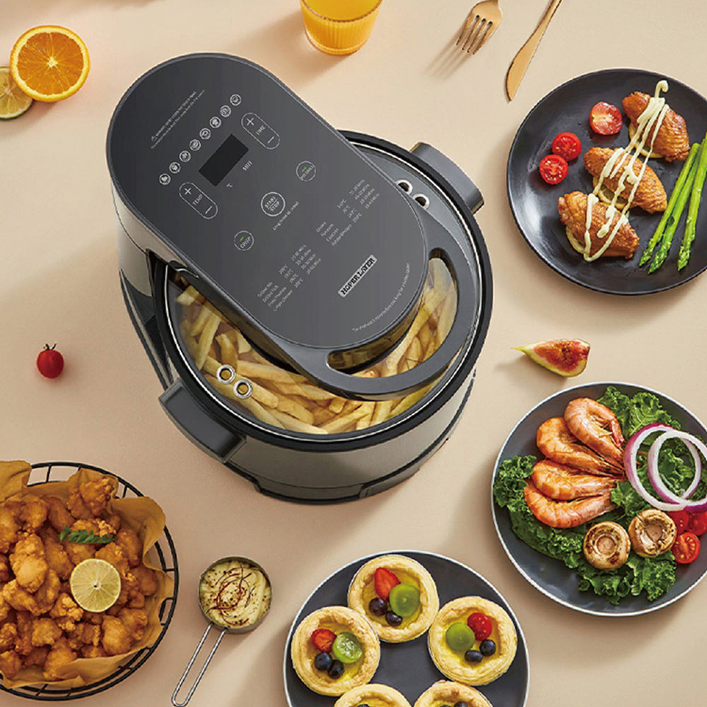 Air fryer with various dishes on a beige surface
