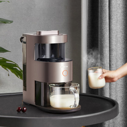 Coffee maker on a tray with a glass of milk and cherries, against a neutral background.