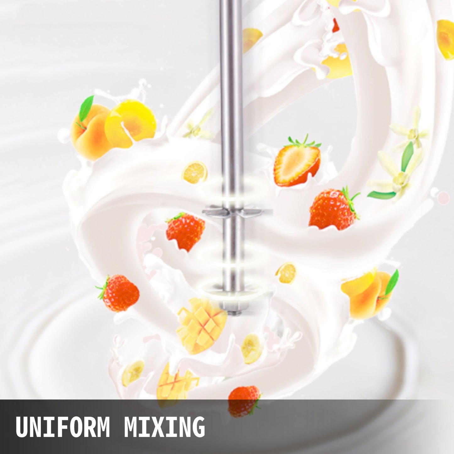 Hand mixer in action with whipped cream and fruit decorations on a white background
