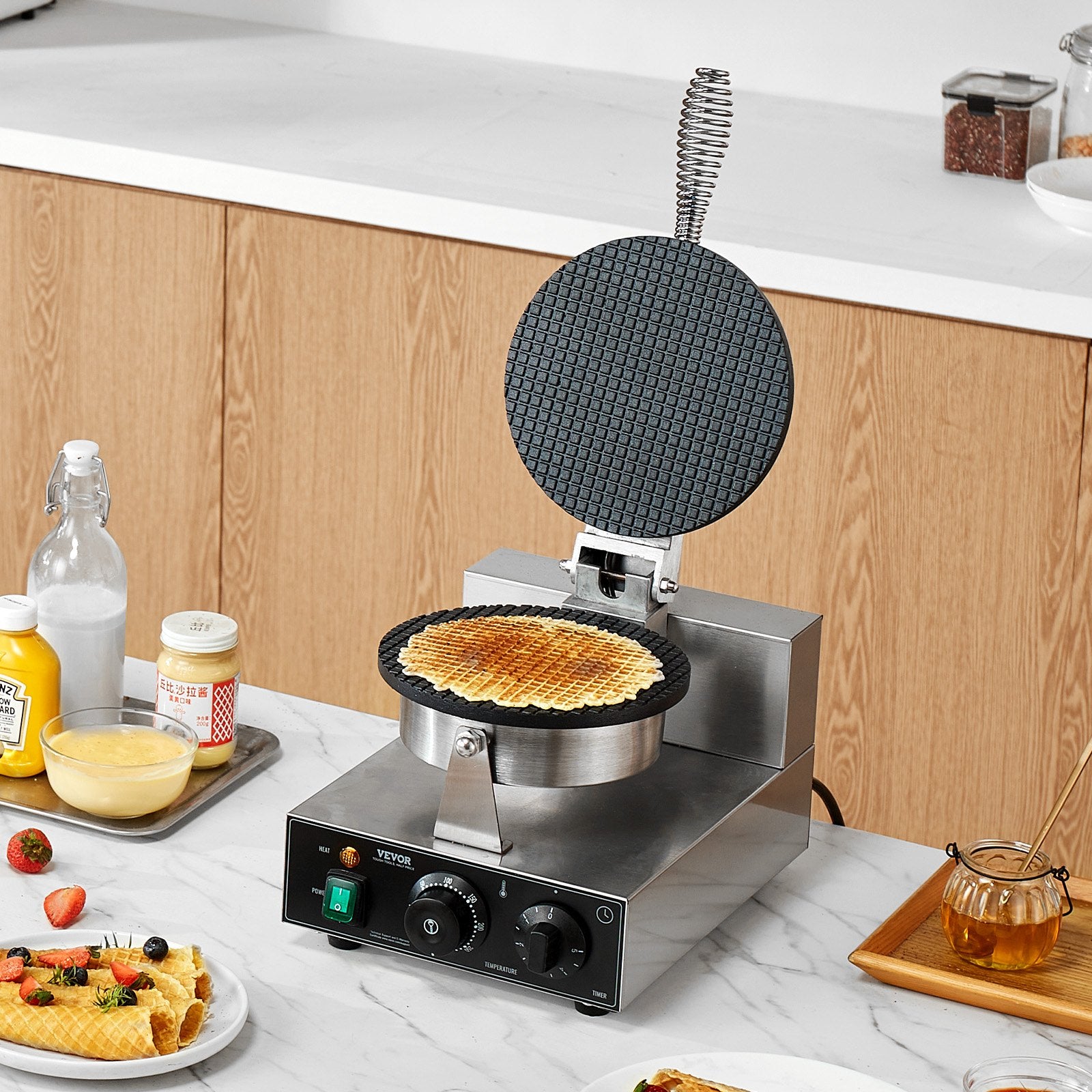 Waffle maker on a kitchen counter with waffle inside, surrounded by kitchen items.