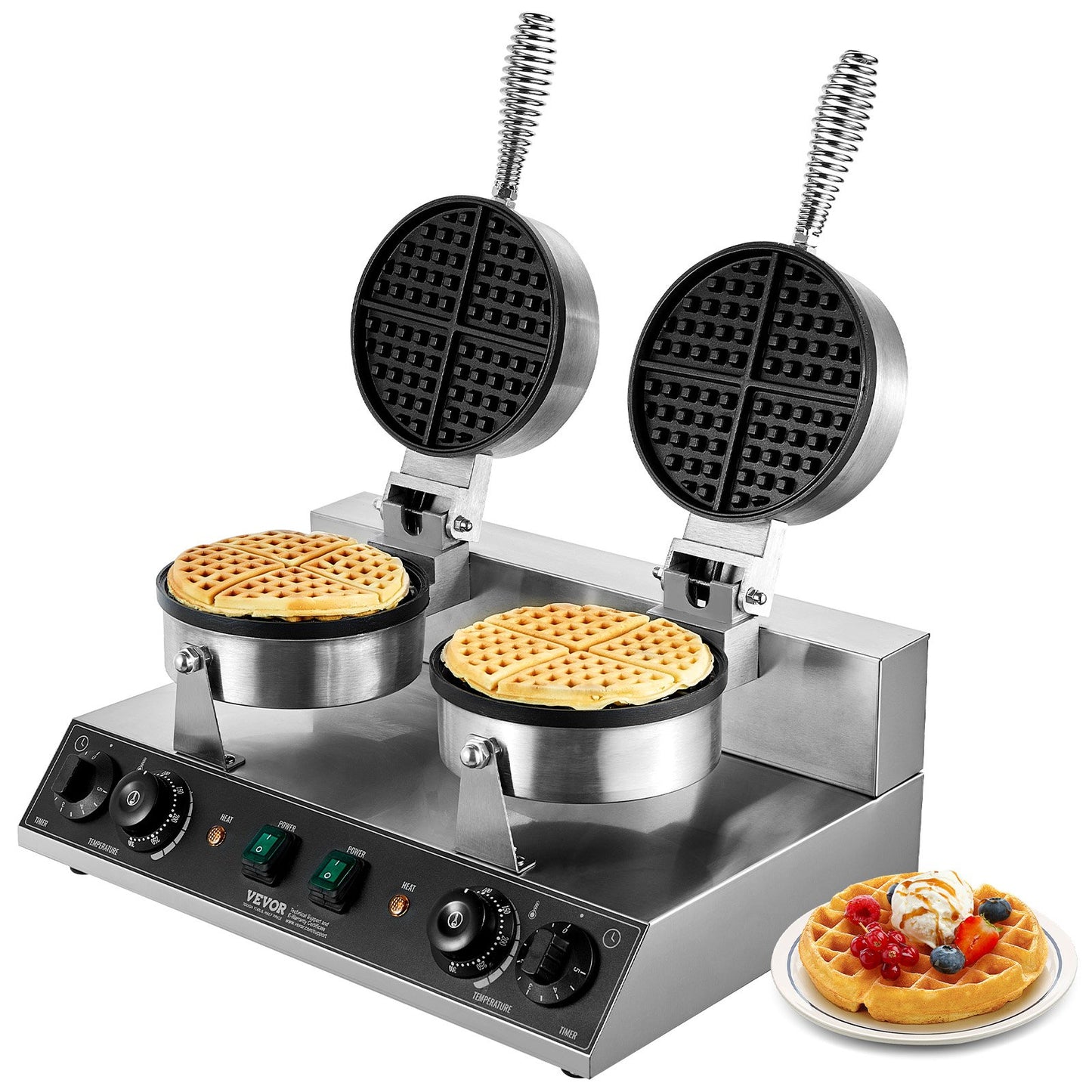 Double waffle maker with two waffles being cooked, one on a plate with toppings.