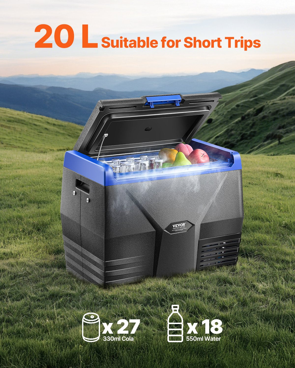 Portable cooler with food items on a grassy field with mountains in the background