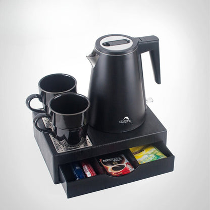Black electric kettle with two mugs and a tray on a white background