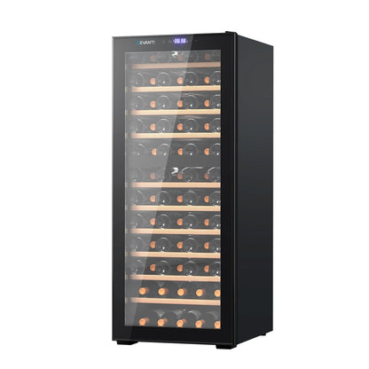 Black wine cooler with glass door displaying wine bottles on a white background