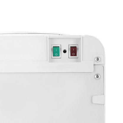 Close-up of a white electronic device with green and red indicator lights on a white background